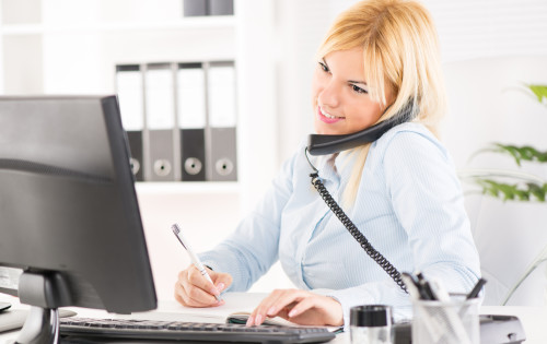 Beautiful Businesswoman telephoning and working in the office.